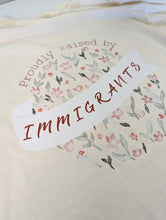 Load image into Gallery viewer, Proudly Raised by Immigrants Floral T-shirt
